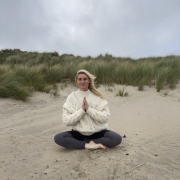 Winter Pranayama, Genny Brown practicing on a beach