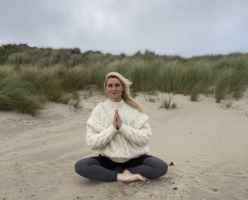 Winter Mindfulness, Genny Brown practicing on a beach