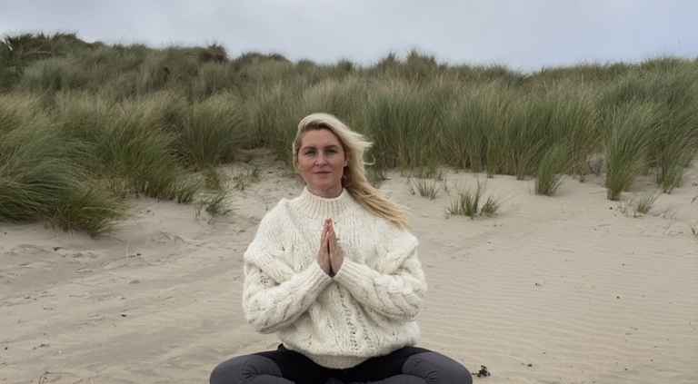 Winter Pranayama, Genny Brown practicing on a beach