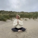 Winter Pranayama, Genny Brown practicing on a beach